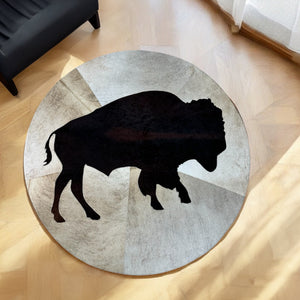 Round cowhide buffalo rug in room