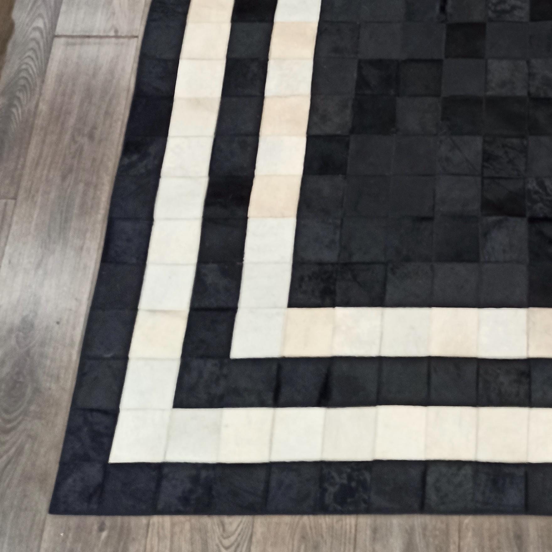 Black and White Border Cowhide Rug