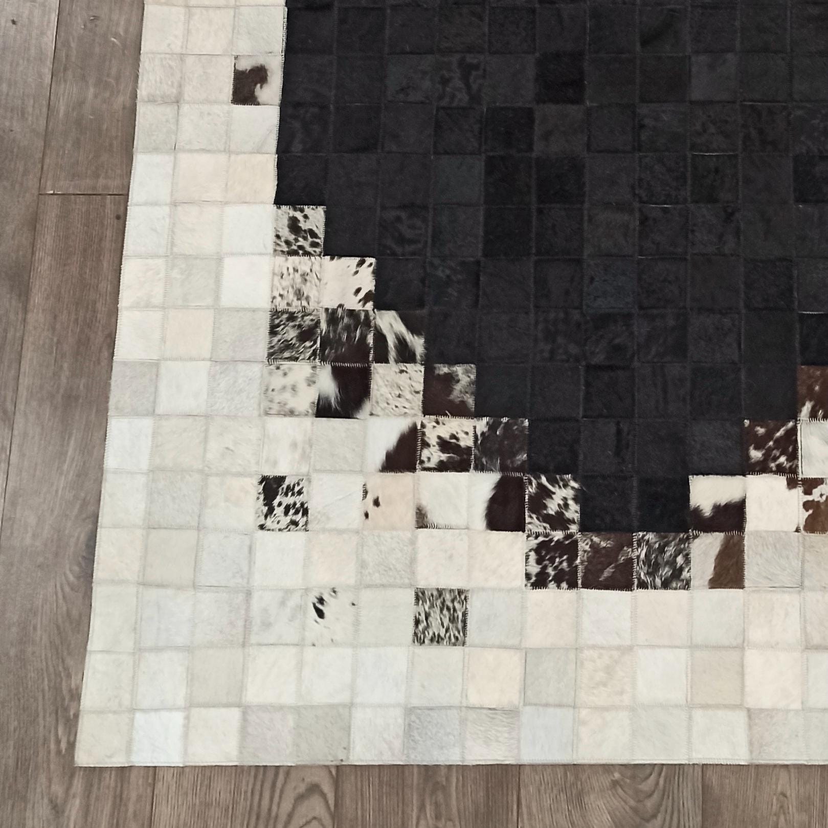 Black Oval Pattern Cowhide Area Rug