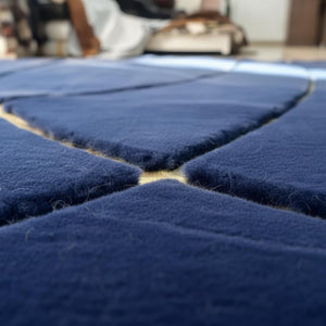 Midnight navy plush rug with gold line art