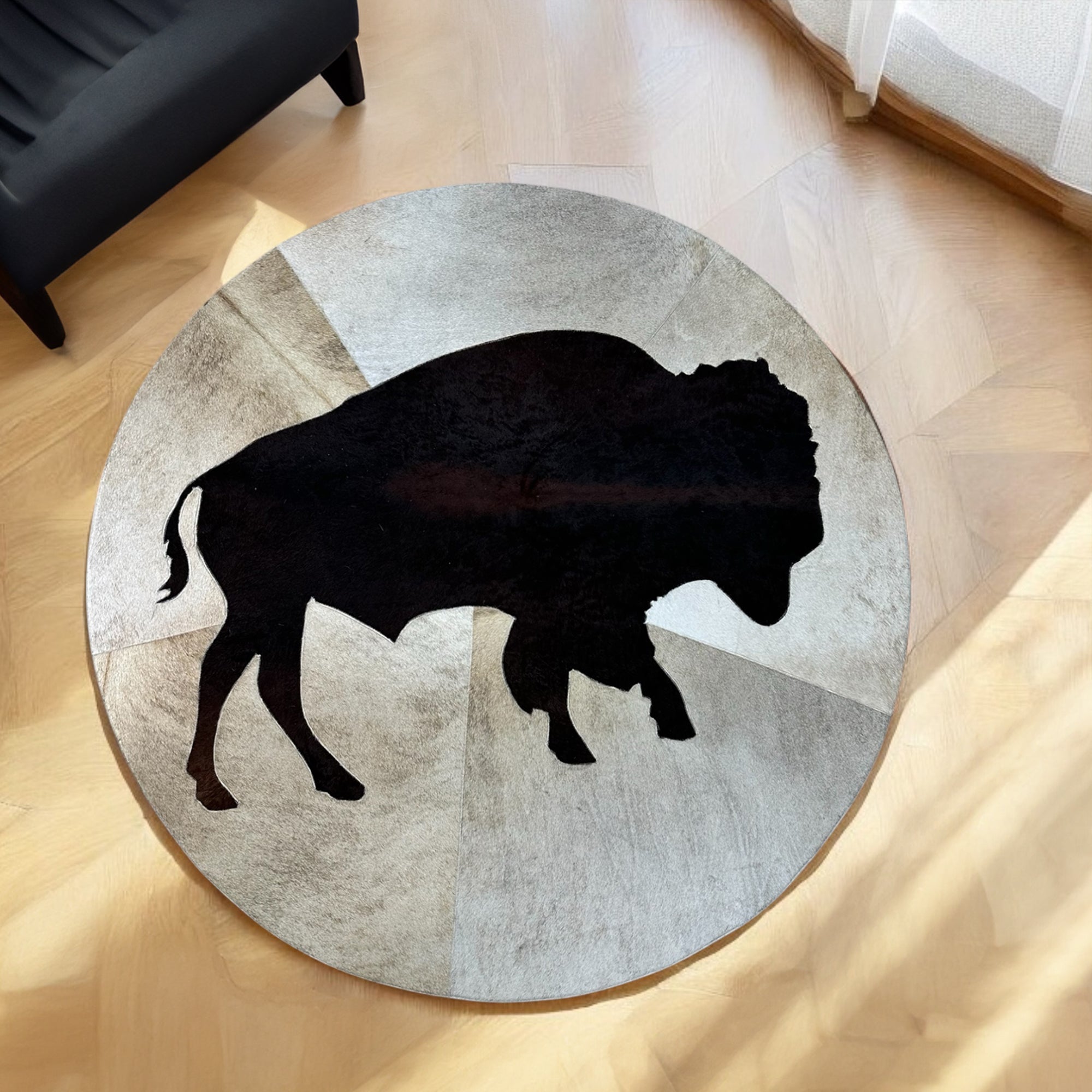 Round cowhide buffalo rug in room