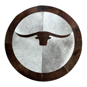 Round cowhide longhorn rug in room