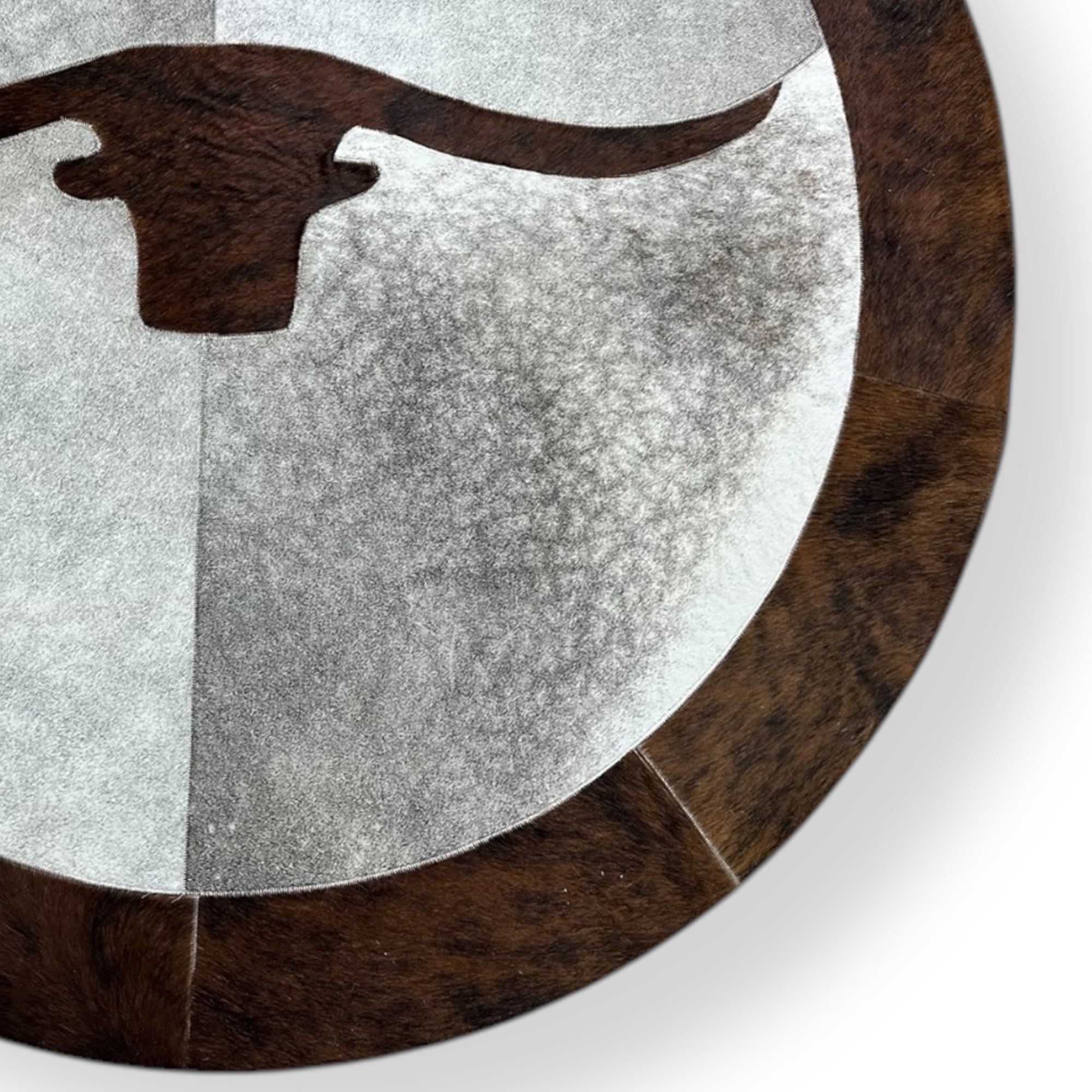 Round cowhide longhorn rug detail