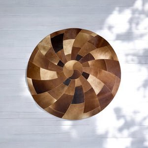 Round spiral brown cowhide rug