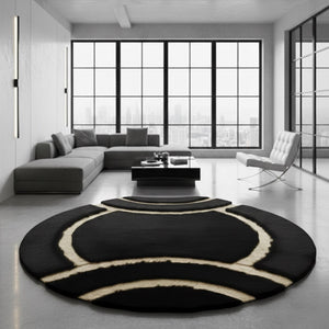 Round black plush rug in room
